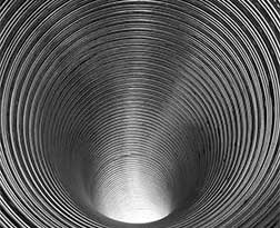 Stock photo of Chimney Relining - Advance Chimney New ribbed chimney liner looking down the pipe