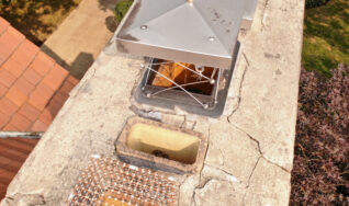 Advance Chimney Sweeps of Pittsburgh with chimney cap and damper reparis