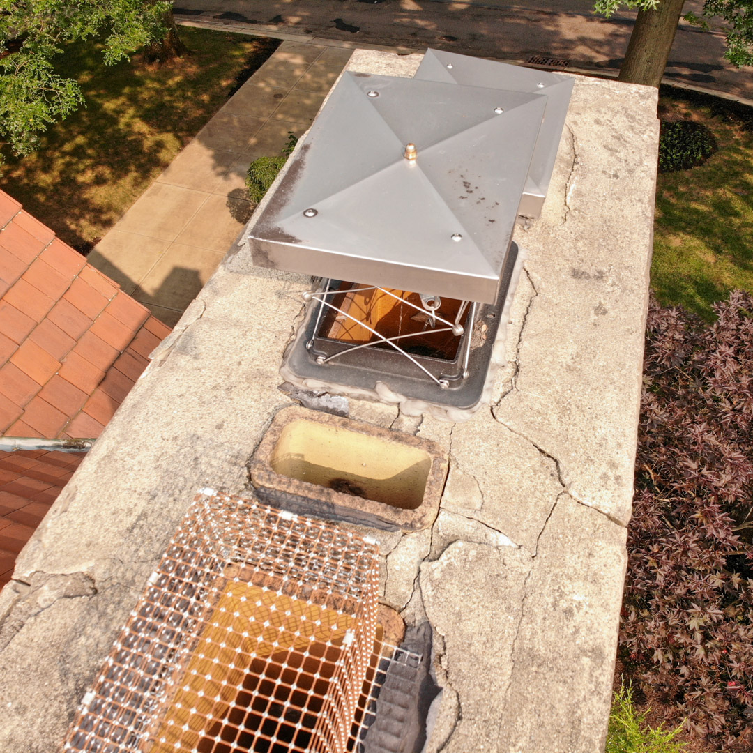 Advance Chimney Sweeps of Pittsburgh with chimney cap and damper reparis